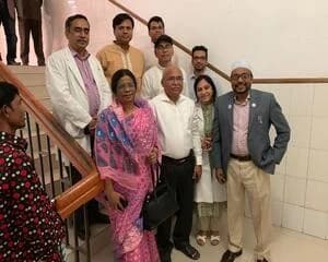 Prof. Ayub Ali with colleagues on a staircase