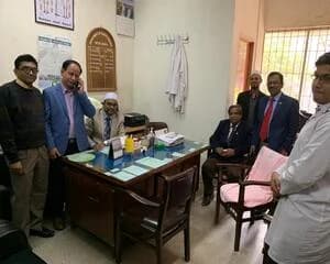 Prof. Ayub Ali with doctors in an office